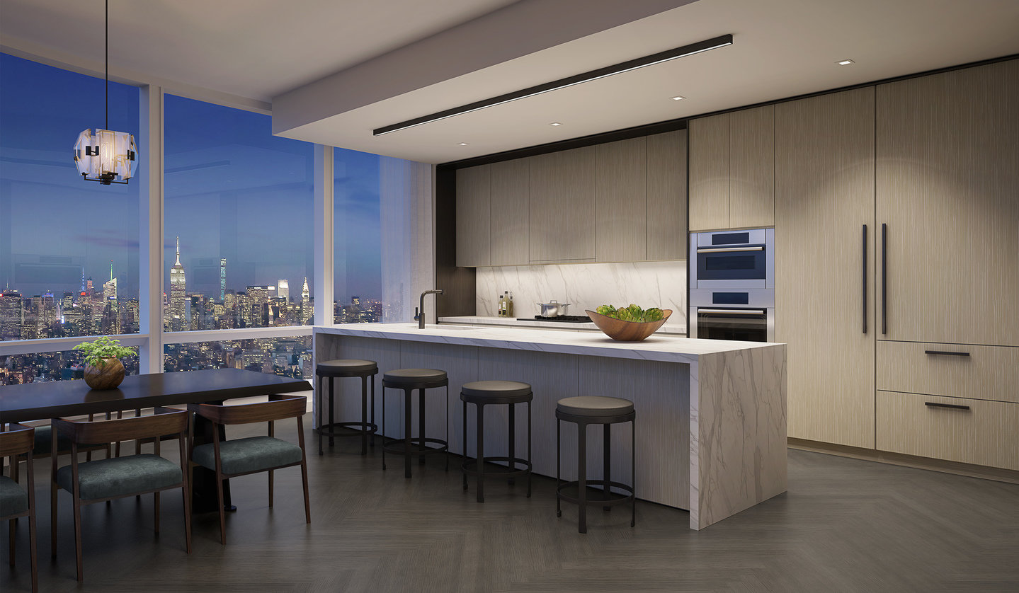 Modern open-plan dining room and kitchen with city view, white marble counter and stools and whitewashed wood cabinetry.