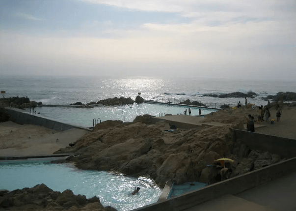 Leca Swimming Pools in Porto, Portugal, designed by Alvaro Siza Vieira, built into the coastline and filled with sea water.